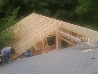 Framing a new roof addition that ties into an existing shingle roof in Ragland